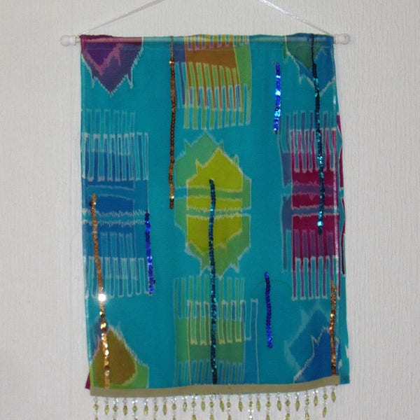 Ikat  Wall Hanging in two layers of silk with sequin and beaded 1.5 inch fringe.  25 pencent off from 135.00