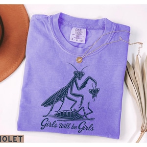 Girls Will Be Girls praying mantis shirt by The NY Bach Label on a Violet Comfort Colors 1717 tee.