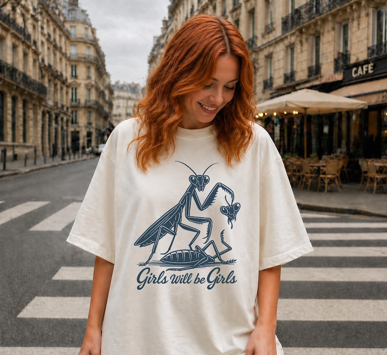 Oversized White leftist shirt featuring a retro praying mantis graphic for nature lovers.