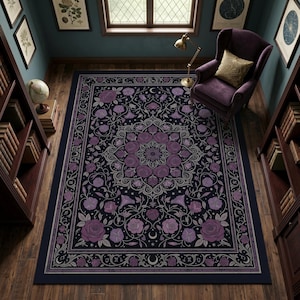 May include: A rectangular area rug featuring a dark background with a central mandala pattern composed of purple roses and light gray floral vines. The border includes repeating rose motifs, crescent moons, and small star-like accents.