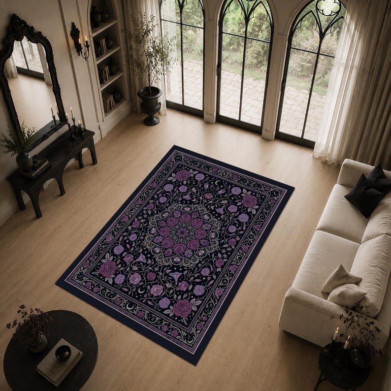 May include: A rectangular area rug featuring a dark navy blue background with a central mandala pattern composed of purple roses and intricate white floral line work, surrounded by a decorative border of matching purple flowers and vines.
