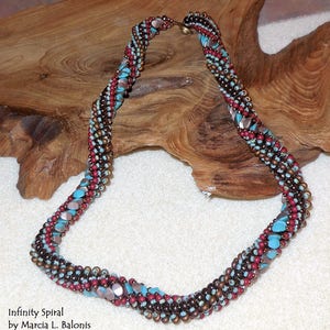 May include: A multi-colored beaded necklace with a spiral design. The necklace is made with brown, red, and turquoise beads. The necklace is called "Infinity Spiral" by Marcia L. Balonis.