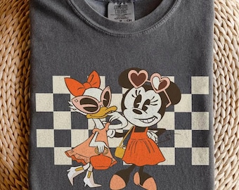 Comfort Colors Disney Minnie And Daisy Bestie Shirt, Disney Girls Shirt, Minnie Mouse And Daisy Duck Checkered Shirt, Girl Vacation Shirt