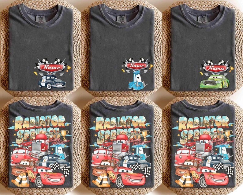 May include: Six dark grey t-shirts with car-themed designs. The top row shows a race car design with the word "Name". The bottom row features a "Radiator Springs" design with various cartoon cars.