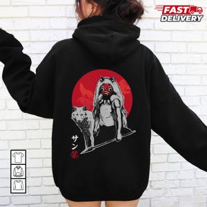May include: Black hoodie featuring a graphic of a wolf and a figure with a red mask in front of a red circle. Japanese text is below the wolf. The hoodie has a drawstring hood and long sleeves. The words "Fast Delivery" are printed on the upper right.