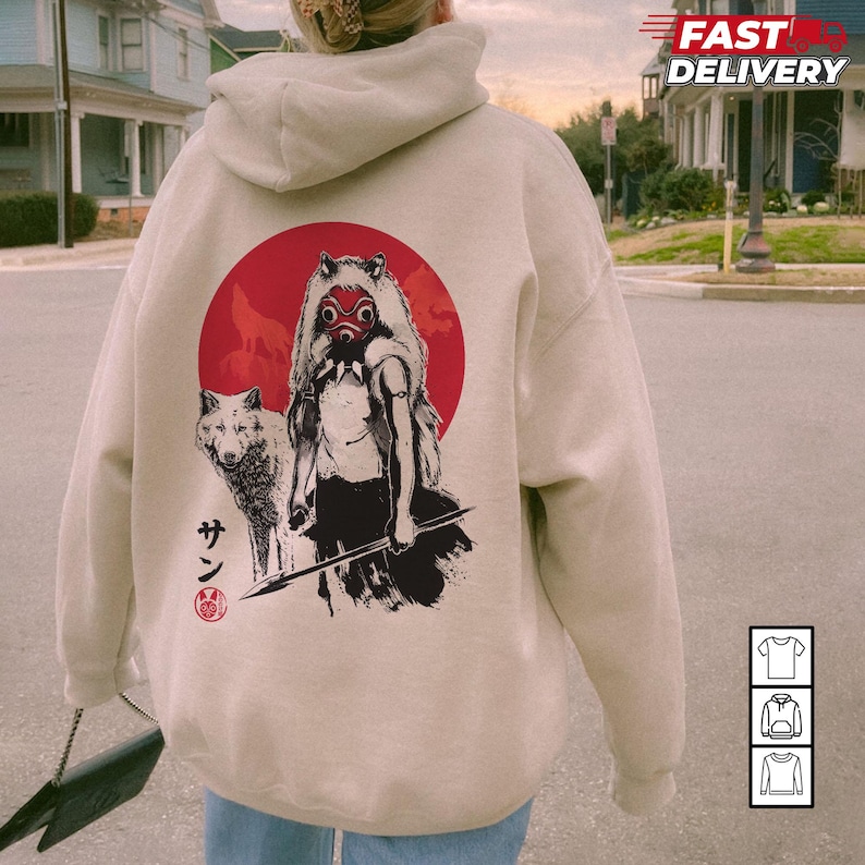 May include: A beige hoodie featuring a graphic of a figure with a wolf and a red sun. The graphic is in black and white with red accents. The hoodie has a hood and long sleeves. The words "Fast Delivery" are printed on the top right.