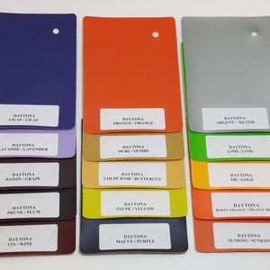 May include: A color chart with 18 different shades of paint, each with a label indicating the color name and its corresponding French and English names. The colors range from purple to orange, with shades of green, yellow, brown, and gray.