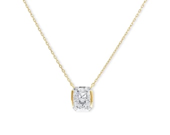 May include: A gold necklace with a large, square-cut, clear gemstone pendant. The pendant is set in a gold bezel and hangs from a delicate gold chain. The necklace is shown against a white backdrop.