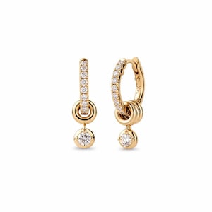 May include: A pair of gold hoop earrings featuring a row of small clear stones along the front of the hoop. Each earring has a dangling circular charm with a single clear stone in the center. The inner side of one hoop is stamped with 14K.