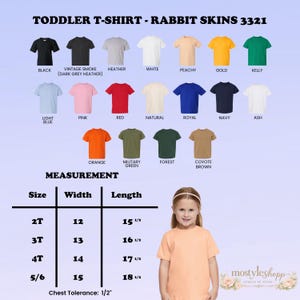 May include: A variety of toddler t-shirts in various colors, including black, white, pink, and blue. The image displays a size chart with measurements in inches. The text on the image reads "TODDLER T-SHIRT - RABBIT SKINS 3321".