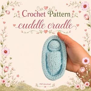 May include: A light blue crochet cradle containing a small crocheted figure, featuring the text Crochet Pattern cuddle cradle and PDF download. The design is surrounded by a floral border with pink flowers, green stems, and small red hearts.