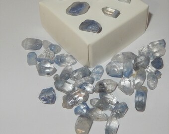 Dumortierite in Quartz crystal- tumbled - tiny