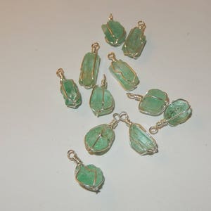 Emerald pendant- raw crystal wrapped in sterling silver wire