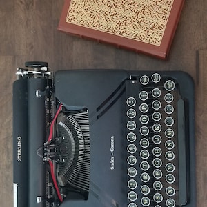 Smith Corona Sterling Typewriter. Excellent (1940's) in great working condition. With case, manual, guarantee.