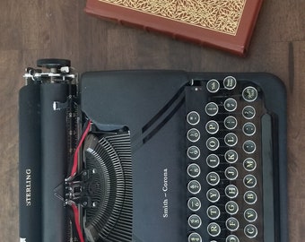 Smith Corona Sterling Typewriter. Excellent (1940's) in great working condition. With case, manual, guarantee.