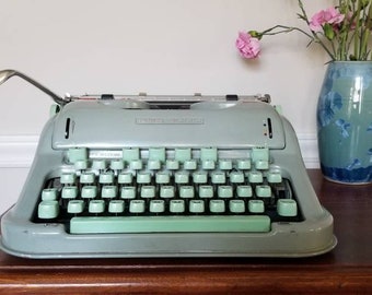 Gorgeous Hermes 3000 Manual Typewriter. Serviced with case, fresh ribbon, and working guarantee. New rollers and feet.