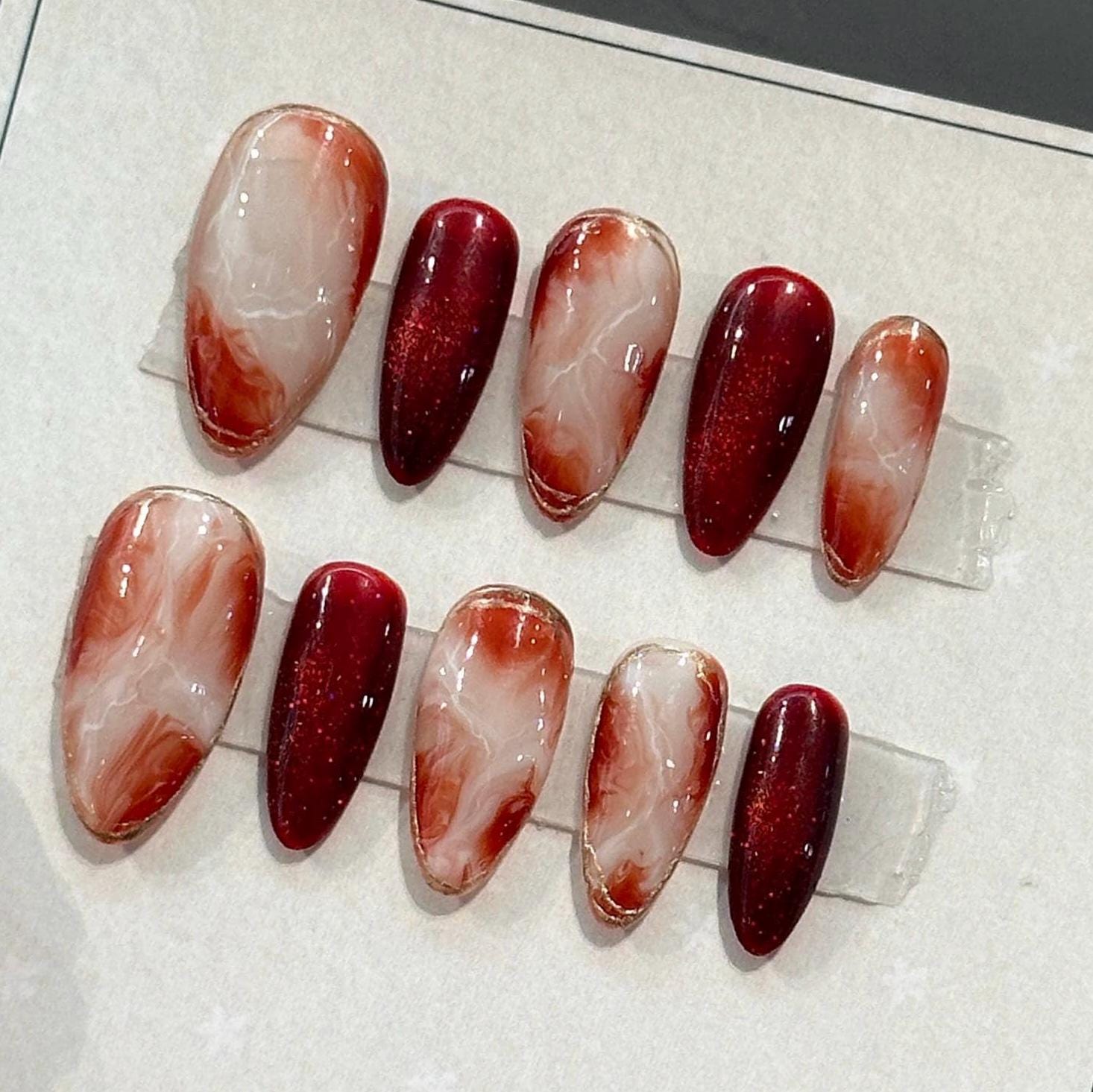 Elegant Red Marble Nail Design
