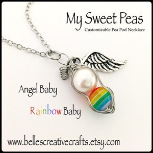 May include: A silver-toned necklace featuring a pea pod pendant with a pearl and a rainbow-colored bead. The pendant is wire-wrapped and includes a small silver wing charm. Text on the image reads "My Sweet Peas" and "Angel Baby Rainbow Baby".