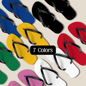 May include: A collection of colorful flip-flops in various shades, including blue, black, yellow, green, red, white, and pink. Each flip-flop has a black strap. The image includes the text "7 Colors".
