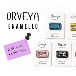 May include: A selection of enamel pins on white cards, shaped like tickets, with themes such as "Book Club" and "Smut Club." The pins are in blue, yellow, pink, and black. The brand name "Orveya Enamello" is displayed at the top of the image.
