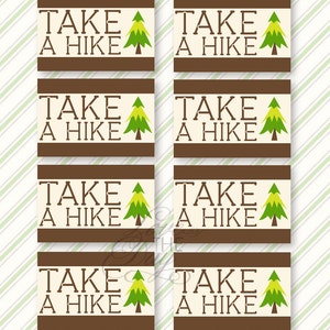 May include: Eight rectangular cards with the text "TAKE A HIKE" in brown letters. Each card has a brown border and a green and yellow tree graphic. The background is a light beige with green and white diagonal stripes.