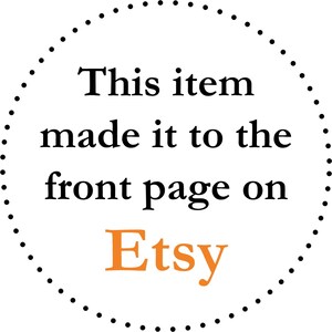 May include: A white circular graphic with a dotted border. The text reads "This item made it to the front page on Etsy" in black, with "Etsy" in orange.