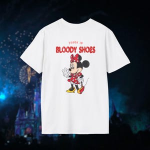 May include: White t-shirt featuring a red and black cartoon image of Minnie Mouse and the text "These is Bloody Shoes".