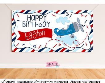 May include: A custom birthday banner with a blue airplane illustration. The banner reads "Happy Birthday Easton" in a playful font, with a red banner and a blue and red striped border. The banner is designed for digital or printed use.