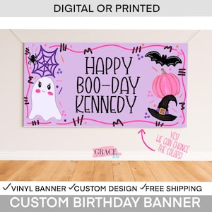 May include: A custom birthday banner with a purple background and Halloween-themed illustrations. The banner reads "Happy Boo-Day Kennedy" with a ghost, spiderweb, bat, pumpkin, and witch hat. The banner is made of vinyl.