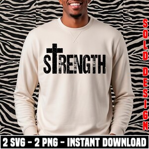 K&ouml;nnte beinhalten: Ein beiges Sweatshirt mit dem Wort "STRENGTH" in gro&szlig;en, verwaschenen schwarzen Buchstaben und einem Kreuz &uuml;ber dem Wort. Der Text "THE JOY OF THE LORD IS MY" ist vertikal in dem Wort "STRENGTH" abgedruckt. Der untere Teil des Bildes enth&auml;lt den Text "2 SVG - 2 PNG - INSTANT DOWNLOAD".