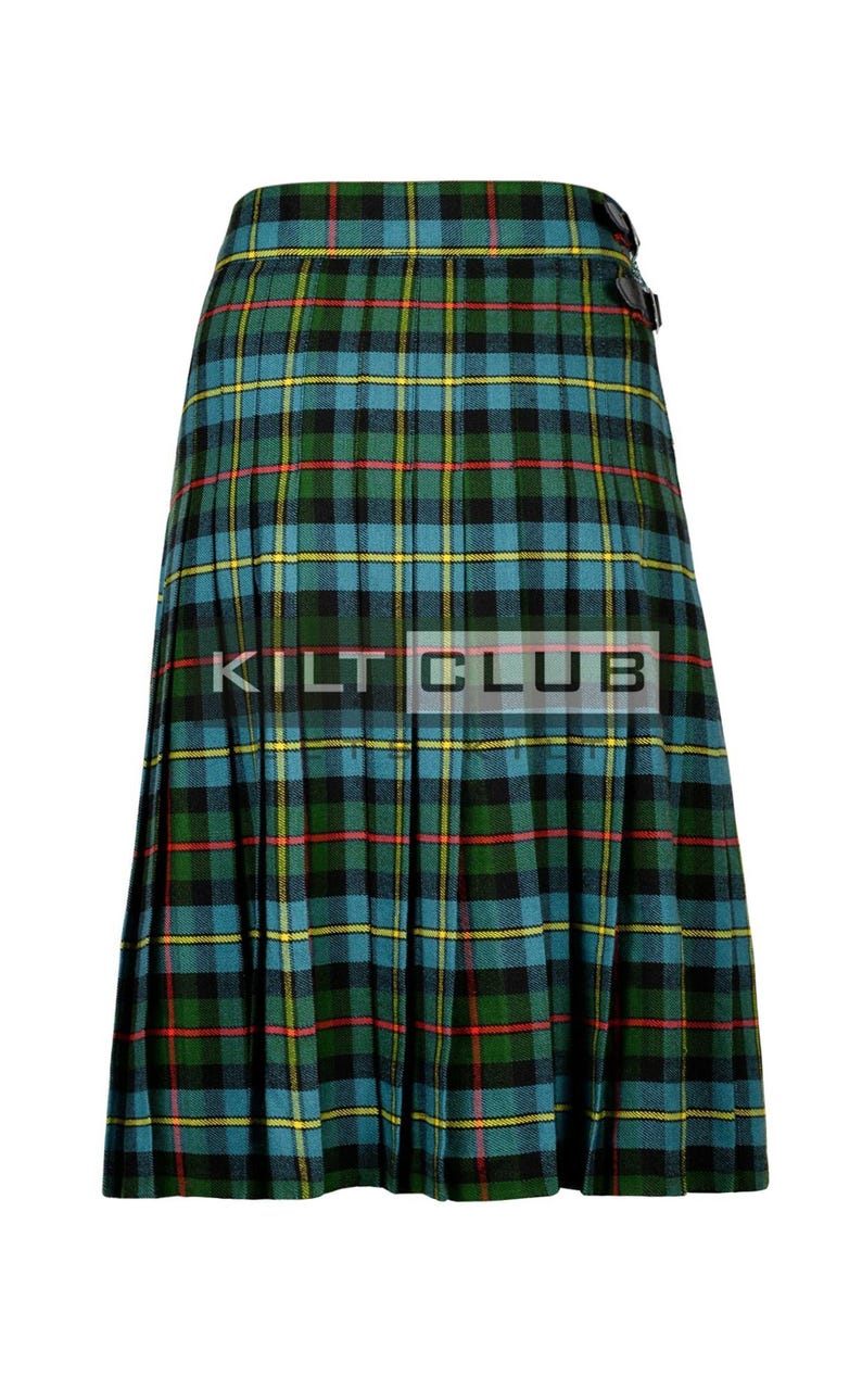 May include: A green, blue, black, and yellow plaid kilt with the text "KILT CLUB". The kilt has pleats and leather buckle closures. The kilt is a traditional Scottish garment.