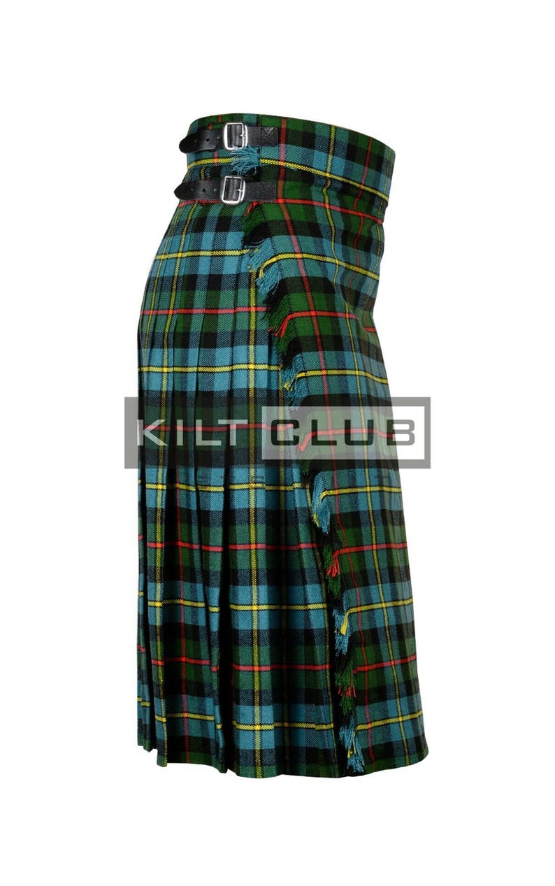 May include: A green, blue, and black plaid kilt with two leather straps and buckles. The kilt has a fringed edge and the text "KILT CLUB" is visible on the front.