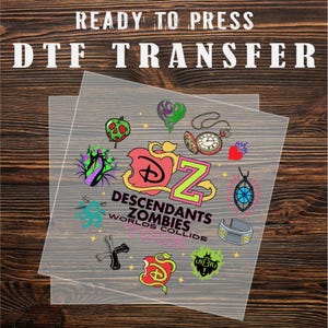 May include: Two clear DTF transfer sheets with colorful graphics. The transfers feature designs from the movie "Descendants Zombies Worlds Collide," including apples, hearts, and the movie logo. Text at the top reads "READY TO PRESS DTF TRANSFER."