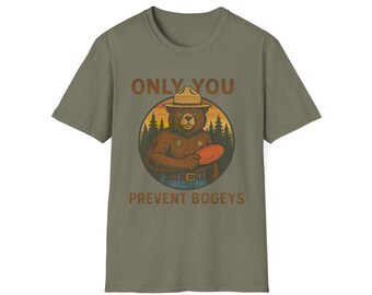 May include: A green t-shirt with a cartoon illustration of a bear wearing a ranger hat and holding a frisbee. The text "ONLY YOU PREVENT BOGEYS" is printed on the shirt.
