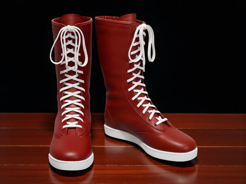 May include: A pair of tall, red boots with white laces and white soles. The boots are made of a smooth material and have a classic design. The laces are tightly laced up the front of the boots. The boots are set against a dark background.