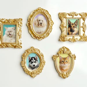 A set of five ornate miniature gold frames, each featuring a hand-painted pet portrait. The frames include a fluffy white cat with a teal background, a poodle with a pearl necklace on a lavender background, a German Shepherd with a green background, a Husky puppy with blue eyes on a teal background, and an orange cat with a yellow background. All frames are detailed with baroque-style carvings and displayed against a light background.
