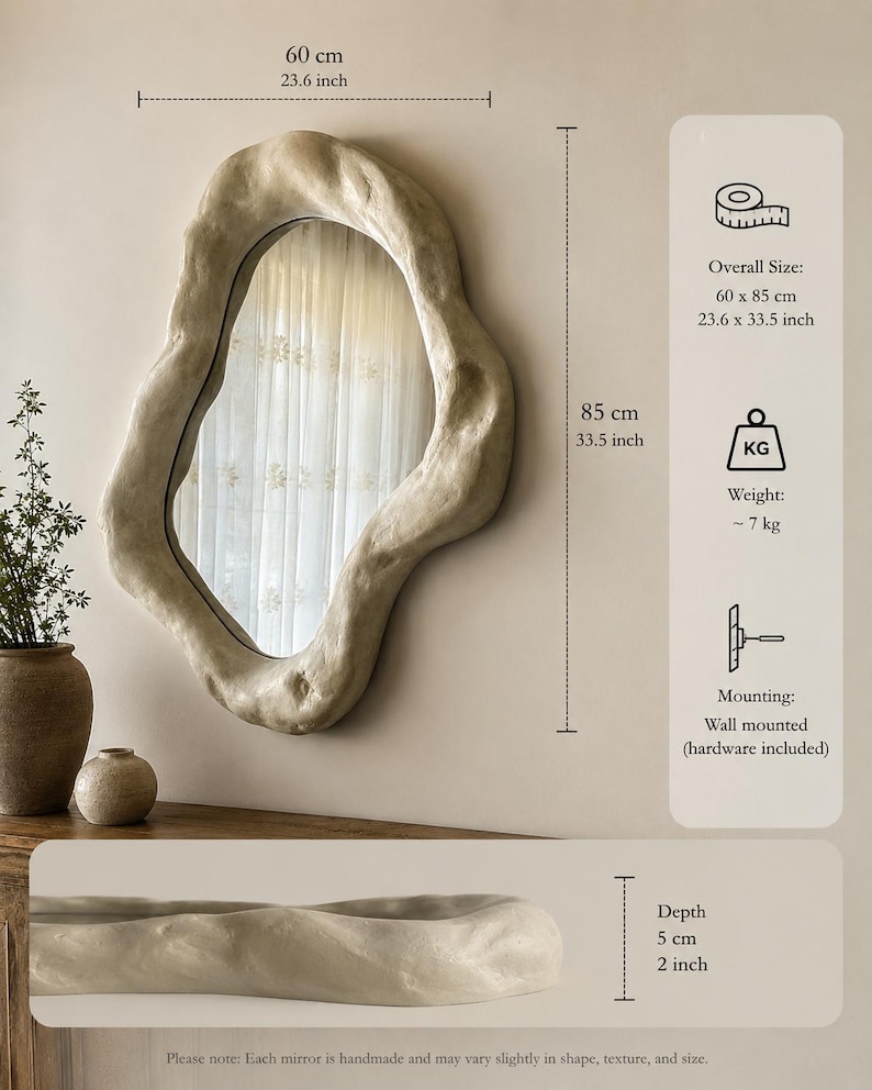 May include: A wall-mounted, irregularly shaped mirror with a textured, off-white frame. The mirror measures 23.6 x 33.5 inches and has a depth of 2 inches. The weight is approximately 15.4 pounds. The handmade mirror includes mounting hardware.