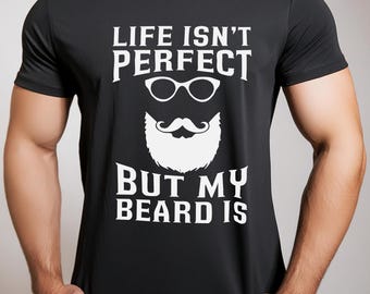 May include: Black t-shirt with a white graphic that says "Life isn't perfect but my beard is". The graphic also includes a white beard with a mustache and a pair of glasses.