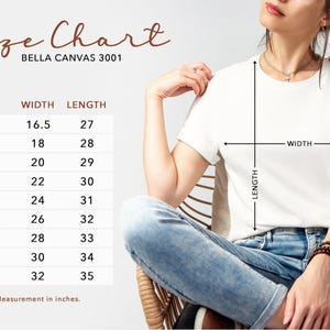 May include: A white Bella Canvas 3001 t-shirt with a size chart. The chart shows measurements in inches for sizes XS to 5XL, including width and length. The model is wearing the t-shirt and blue jeans.
