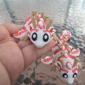 May include: A white ceramic mug with a black handle and the text "But First, Coffee" in a black, bold font. The mug is on a white surface. The mug is 4 inches tall.