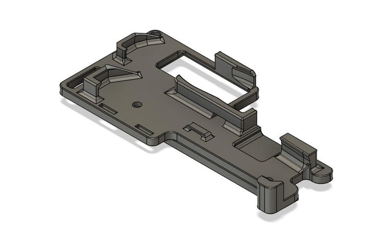 May include: A 3D printed plastic part with a complex design, featuring multiple slots and openings. The part is gray and has a smooth finish.