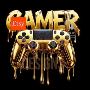 May include: A golden-colored controller with the word "GAMER" above it, and the word "DESIGNS" below it. The controller has a black center panel and black buttons. The Etsy logo is in the upper left corner. The image is on a black background.