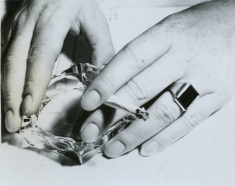 ABSTRACT Close Up of Hands Holding CIGARETTE and ASHTRAY in 1950s Photo