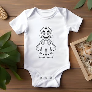 May include: White baby onesie featuring a black outline illustration of the video game character Mario. The design shows Mario in his signature overalls, hat, and gloves. The onesie has short sleeves and snap closures.