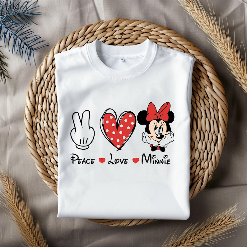 May include: White t-shirt with a peace sign, heart, and Minnie Mouse graphic. The text reads "Peace Love Minnie".