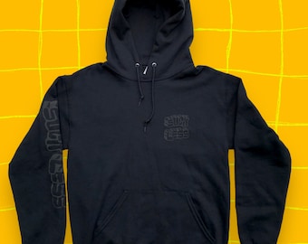 Suck Less all black hoodie