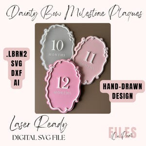 May include: Three oval milestone plaques featuring white hand-drawn bow borders. The grey plaque displays 10 MONTHS, the dusty pink plaque displays 11 MONTHS, and the bright pink plaque displays 12 MONTHS. Text includes Dainty Bow Milestone Plaques, .LBRN2 SVG DXF AI, HAND-DRAWN DESIGN, Laser Ready, DIGITAL SVG FILE, and FILES On Point.