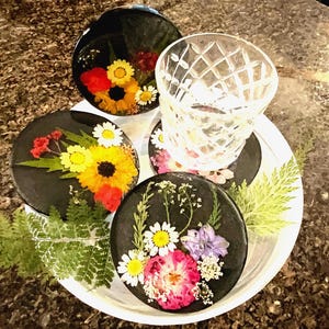 4 Piece black and pressed floral Coaster set
