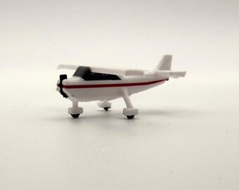 1x Cessna 172 de franja roja a escala 1/400 para maquetas de aeropuertos (compatible con GeminiJets/NG Models)