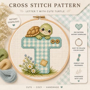 May include: A cross stitch pattern featuring the letter T in a blue and white gingham check design, topped with a small green turtle. The letter is decorated with two brown buttons, a yellow patch, and a cluster of white and blue flowers.